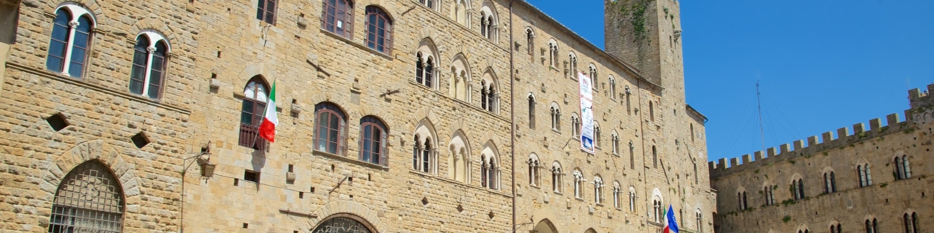 Piazza dei Priori which includes a city, outdoor art and heritage architecture
