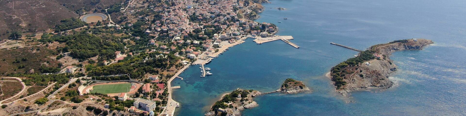 Aerial drone view of the Oinousses island complex east of Chios, Greece. Crystal-clear Aegean waters, scattered islets, rugged coastline and iconic maritime scenery. High-resolution Mediterranean land