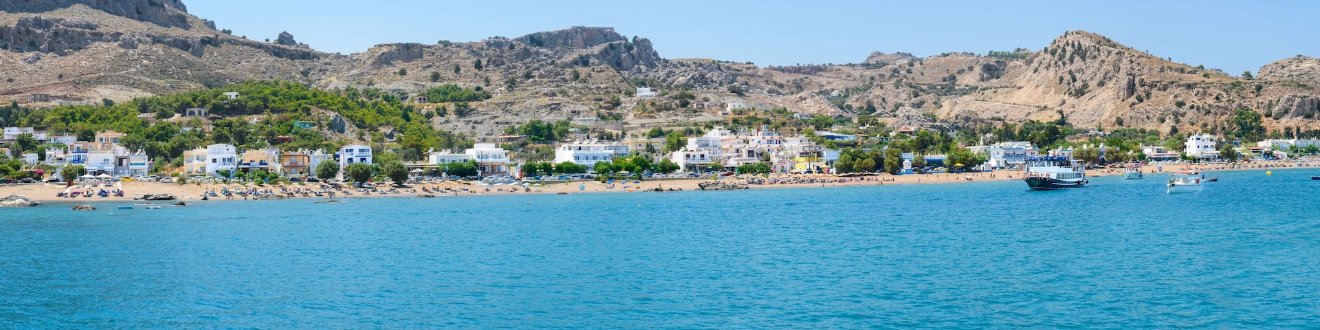 Panoramic view of Stegna beach with apartment houses close to Town of Archangelos (RHODES, GREECE)