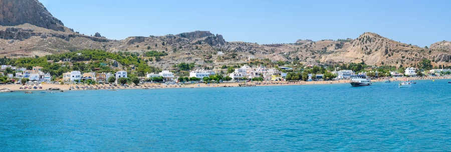 Panoramic view of Stegna beach with apartment houses close to Town of Archangelos (RHODES, GREECE)