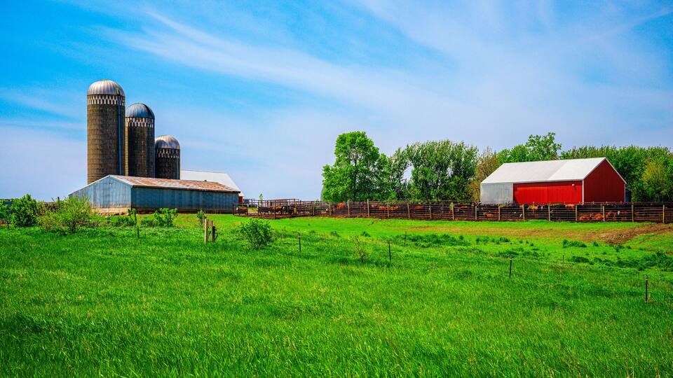 Tranquil farmland summer landscape on the green hill: The beauty of midwestern prairie in Hartford, Minnehaha County, South Dakota