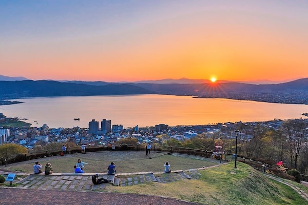 Tateishi Park is a good place to see the sunset over the Lake Suwa in Nagano of Japan.