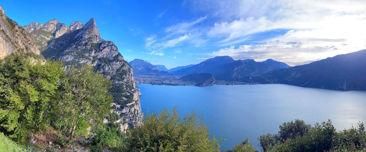 A mountainous landscape with a lake and a clear sky.