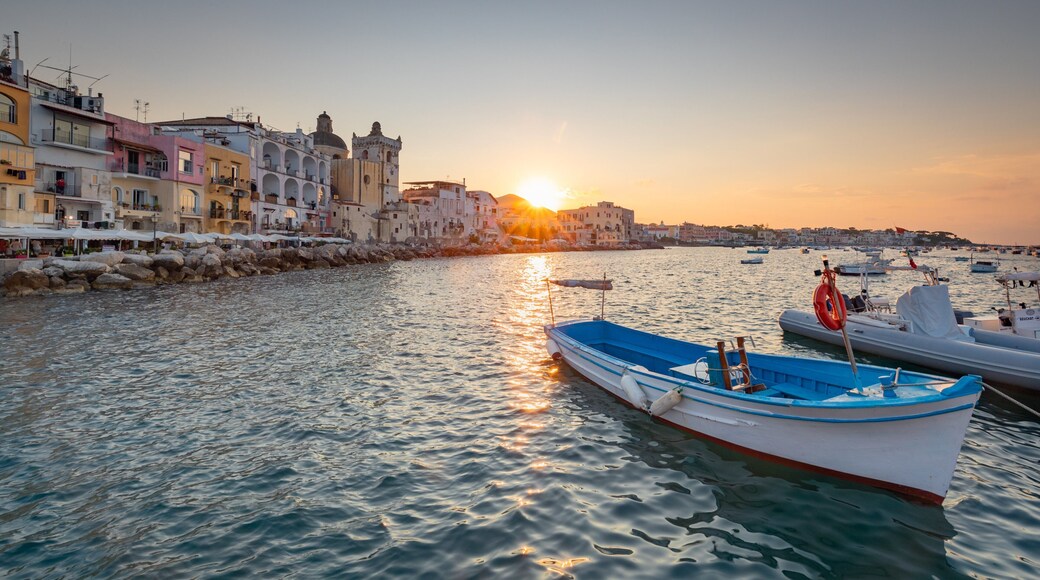 Ischia showing a sunset, a coastal town and a bay or harbor