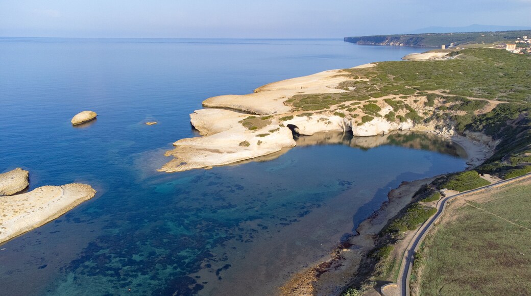 Limestone rock with arch, S`Archittu di Santa Caterina in Oristano Province, Sardinia, Italy