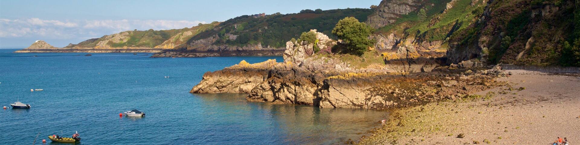 Bouley Bay which includes general coastal views, rugged coastline and a pebble beach