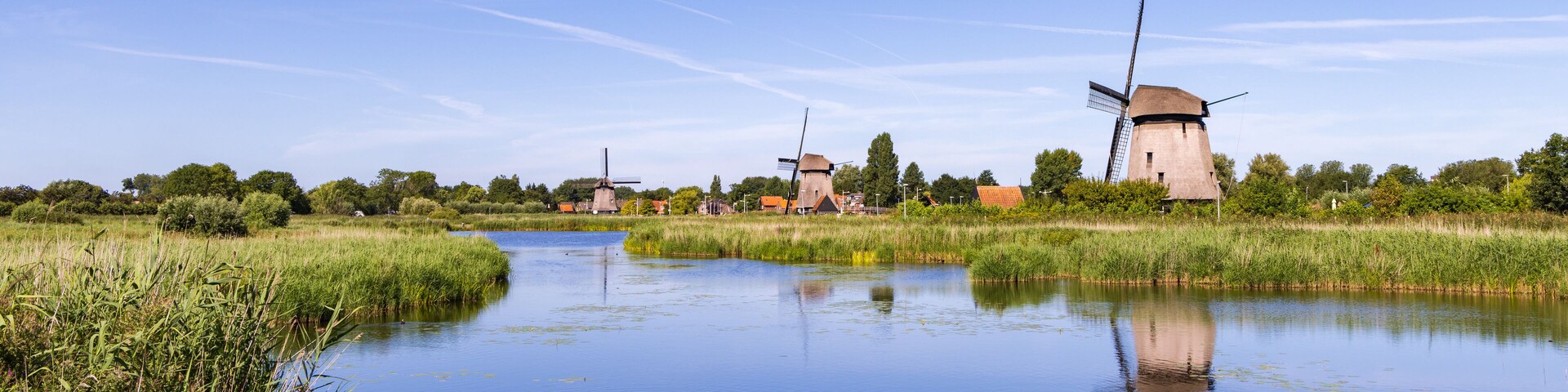 Row traditional windmill at Molenkade Hoornse Vaart in North Holland in The Netherlands