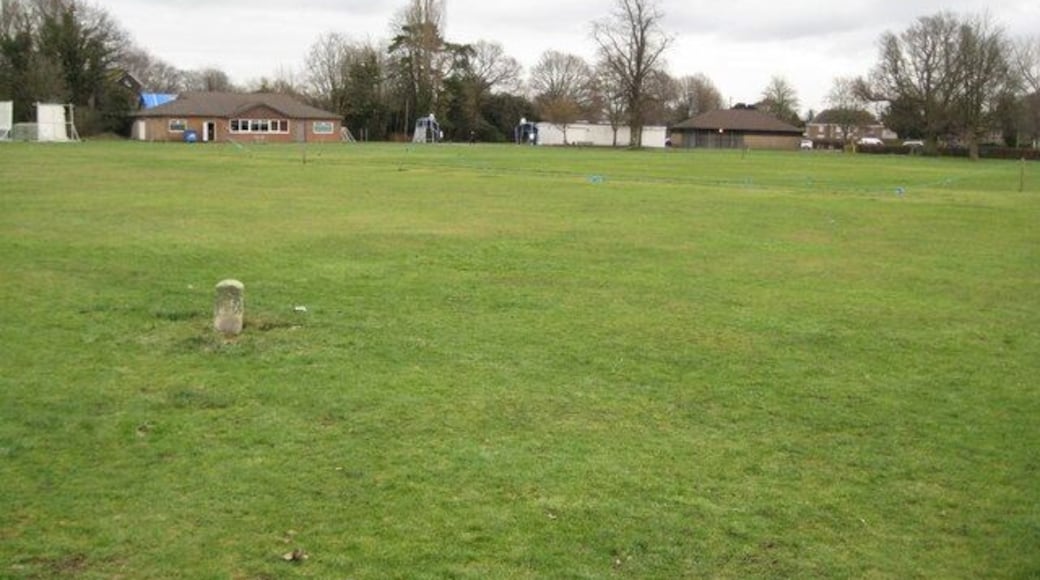 Ifield Green: Inclosure Boundary Stone This small boundary stone is the only surviving one from a group that were required to be placed on the village green under the terms of an Inclosure Award made in 1855. The award allowed inhabitants of the Parish of Ifield to use the area for exercise and recreation at all times of the year. The stone is in the outfield of the cricket pitch and is clearly visible on the satellite imagery of the "Where's the Path" website https://wtp2.appspot.com/wheresthepath.htm The co-ordinates are taken from that imagery. The cricket pavilion is in the background.