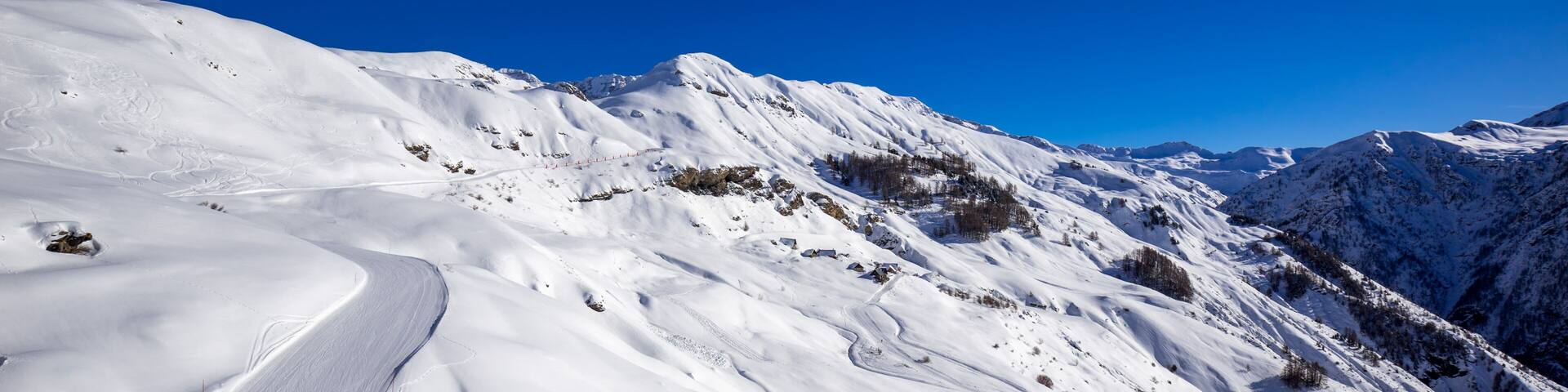 Panoramic view of the slopes of Orcieres-Merlette ski resort in Winter. Hautes-Alpes, Ecrins National Park, Champsaur, Alps, France