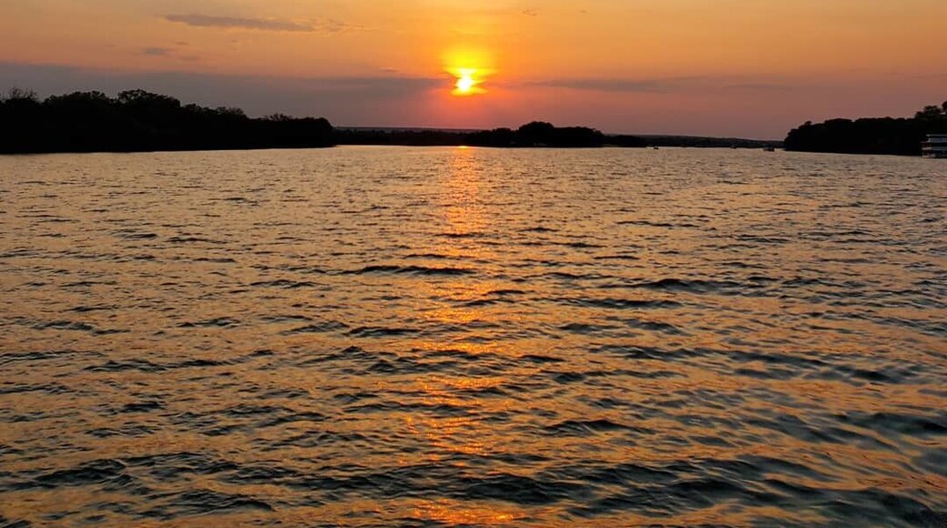 Cruise along the Zambezi River which flows in between Zambia and Zimbabwe