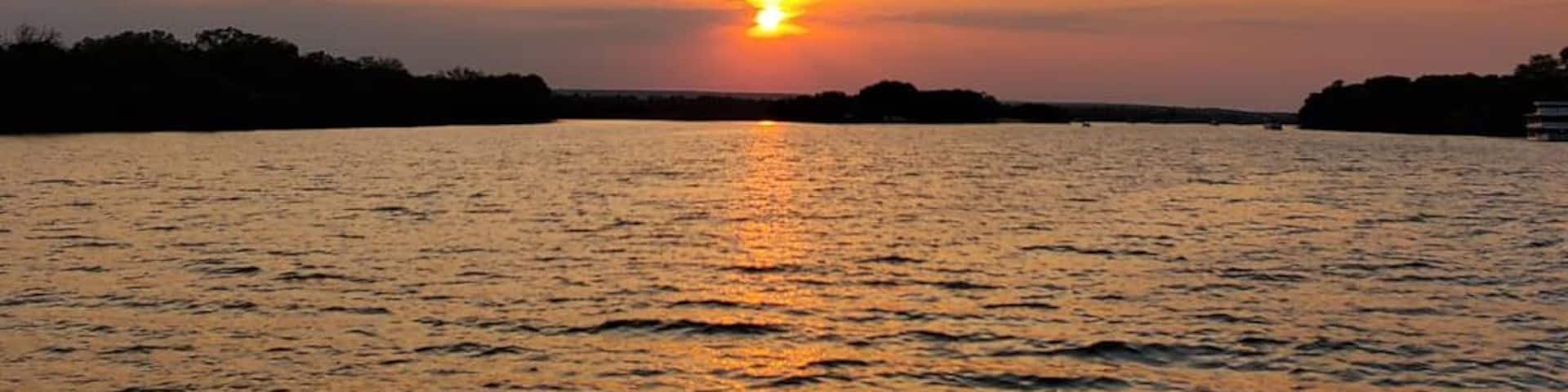 Cruise along the Zambezi River which flows in between Zambia and Zimbabwe