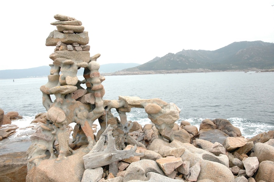 A German artist spent years building these on this bit of coast