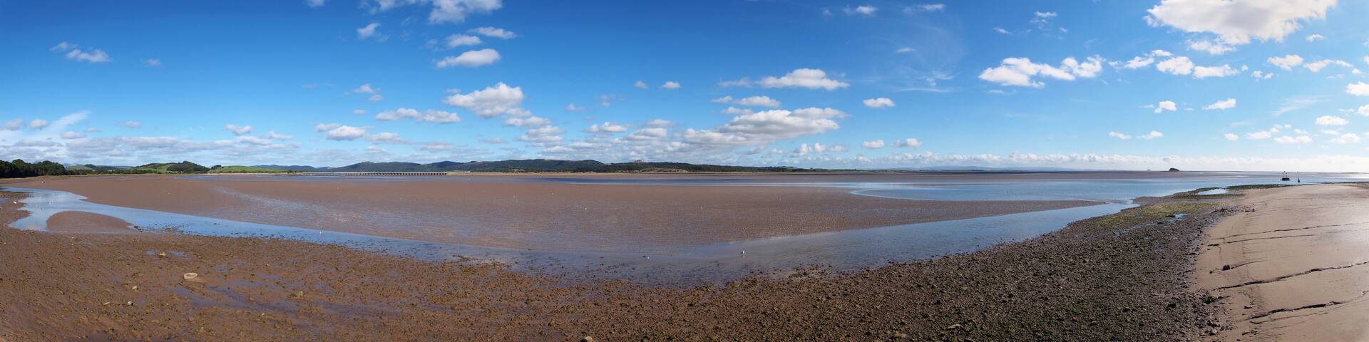 panoramic view of the beach at canal foot in ulverston with a view of the beach a river leven with morecambe bay in the distance