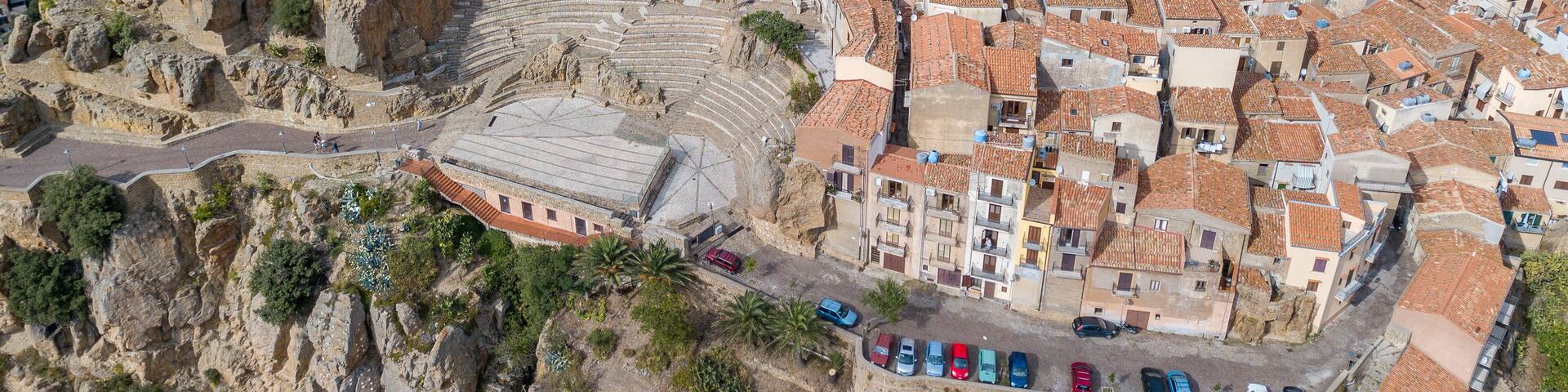 Aerial view over Pollina, beautiful town on top of the mountain in Sicily, Italy