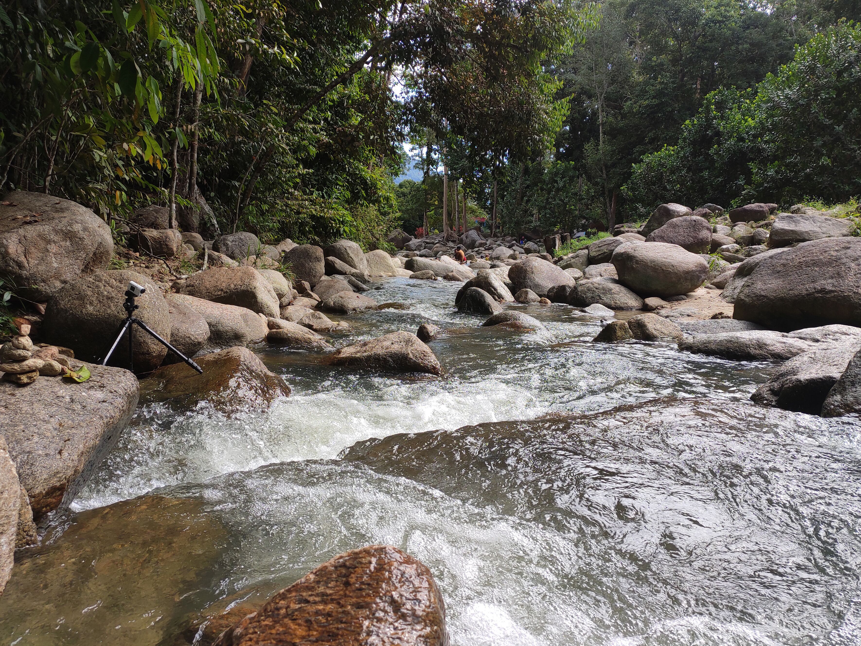 JERAM TOI, MALAYSIA -OCTOBER 22, 2020: Cozy atmosphere during the day at Jeram Toi Recreation Park in Malaysia. Visitors enjoy holidays and picnics with the family.