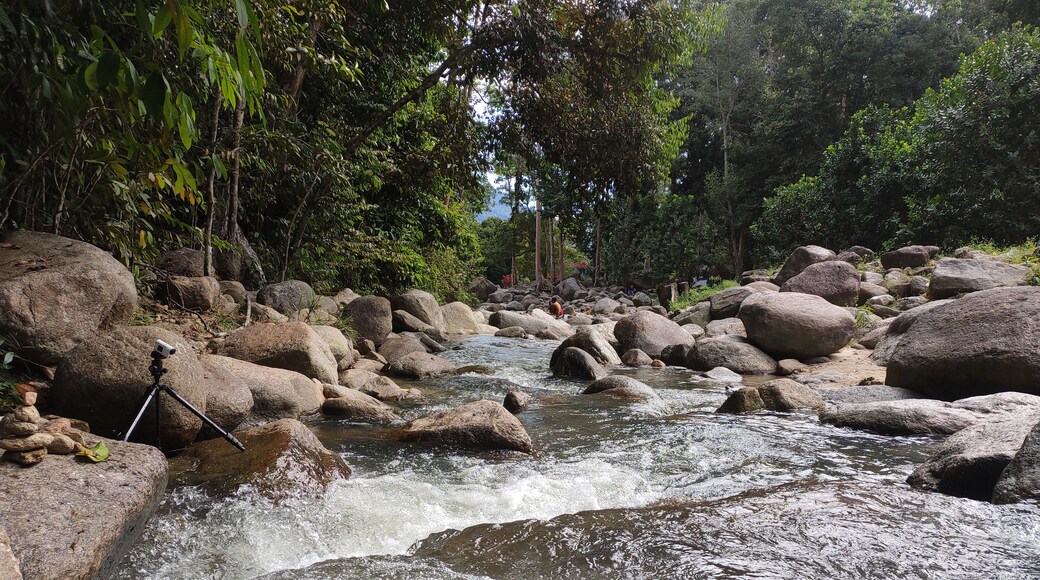 JERAM TOI, MALAYSIA -OCTOBER 22, 2020: Cozy atmosphere during the day at Jeram Toi Recreation Park in Malaysia. Visitors enjoy holidays and picnics with the family.