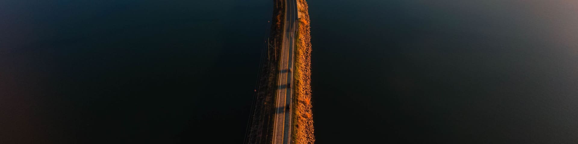 Drone photo of a bridge at sunset