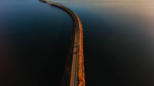Drone photo of a bridge at sunset