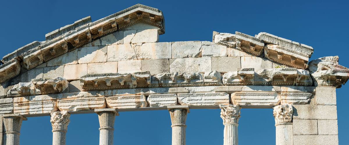 An ancient Greek temple with detailed carvings and columns.