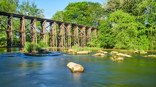 Old wooden railroad bridge over water