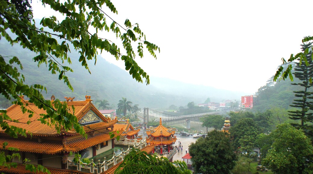 Dijiu Suspension Bridge at Chukou Village, in the Alishan Forest Recreation Area in Chiayi County, Taiwan. Longyin Temple is at the bottom left.