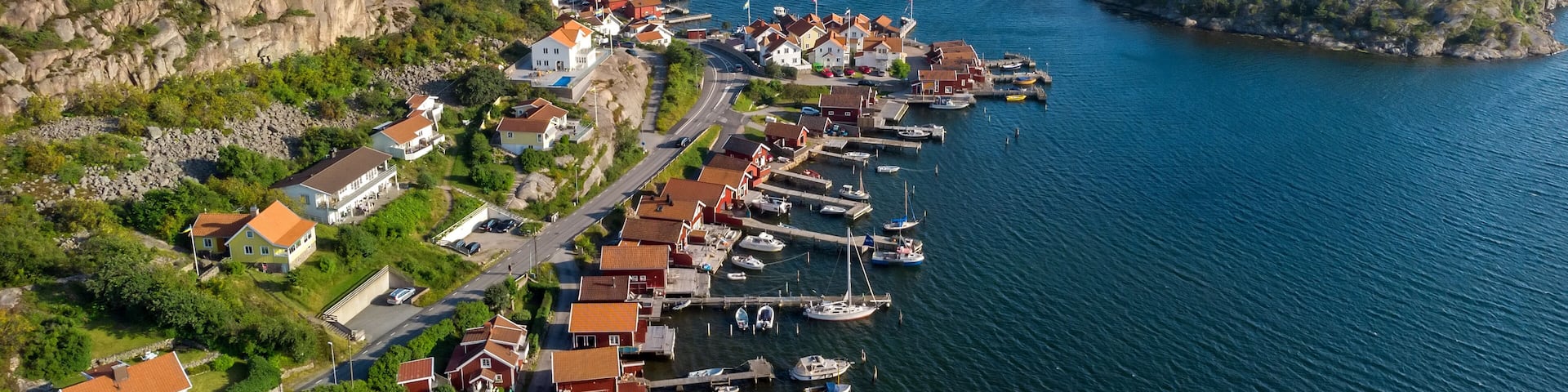 A coastal town with a harbor, houses, and a church.