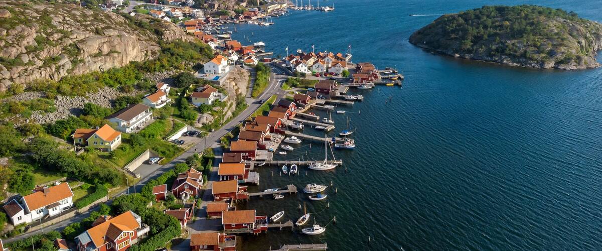 A coastal town with a harbor, houses, and a church.