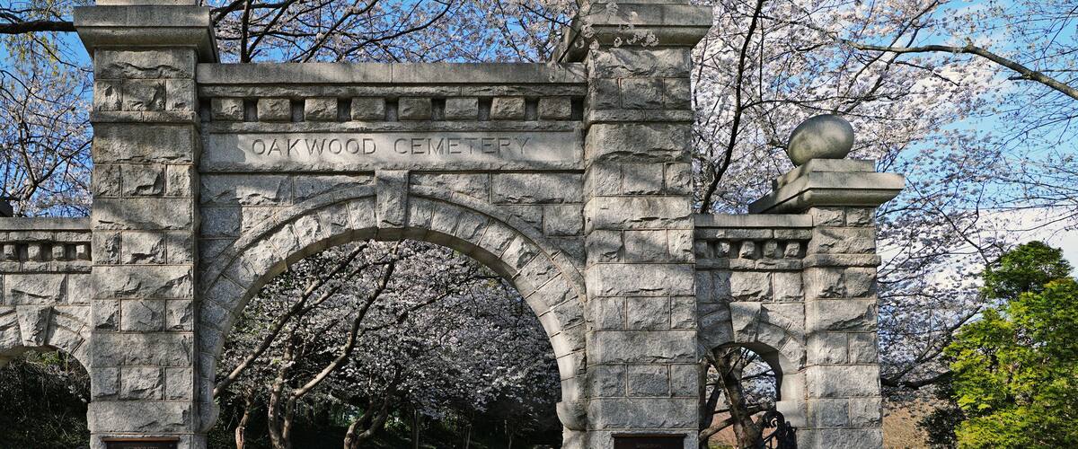 Historic Oakwood cemetery entrance and Spring trees in bloom in Raleigh North Carolina