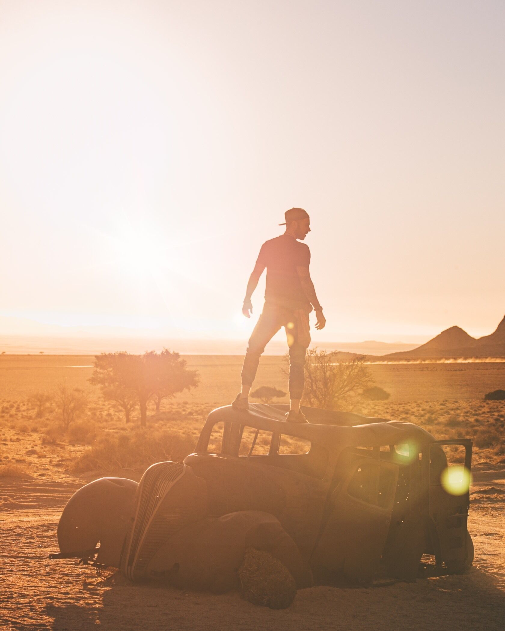 Standing on the bullet ridden getaway car of a diamond thief who didn’t get away. Namibia has a dark history of colonialism, exploitation, and diamond mining. We’re here exploring some of the skeletons hidden in its closet, and uncovering old relics drowning in the sands. 🔥
Ask at the Desert Horse Hotel how to get there, it’s just down the road.