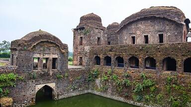 Ruined view of Queen's Palace with well, located in Ramnagar, Mandla, Madhya Pradesh