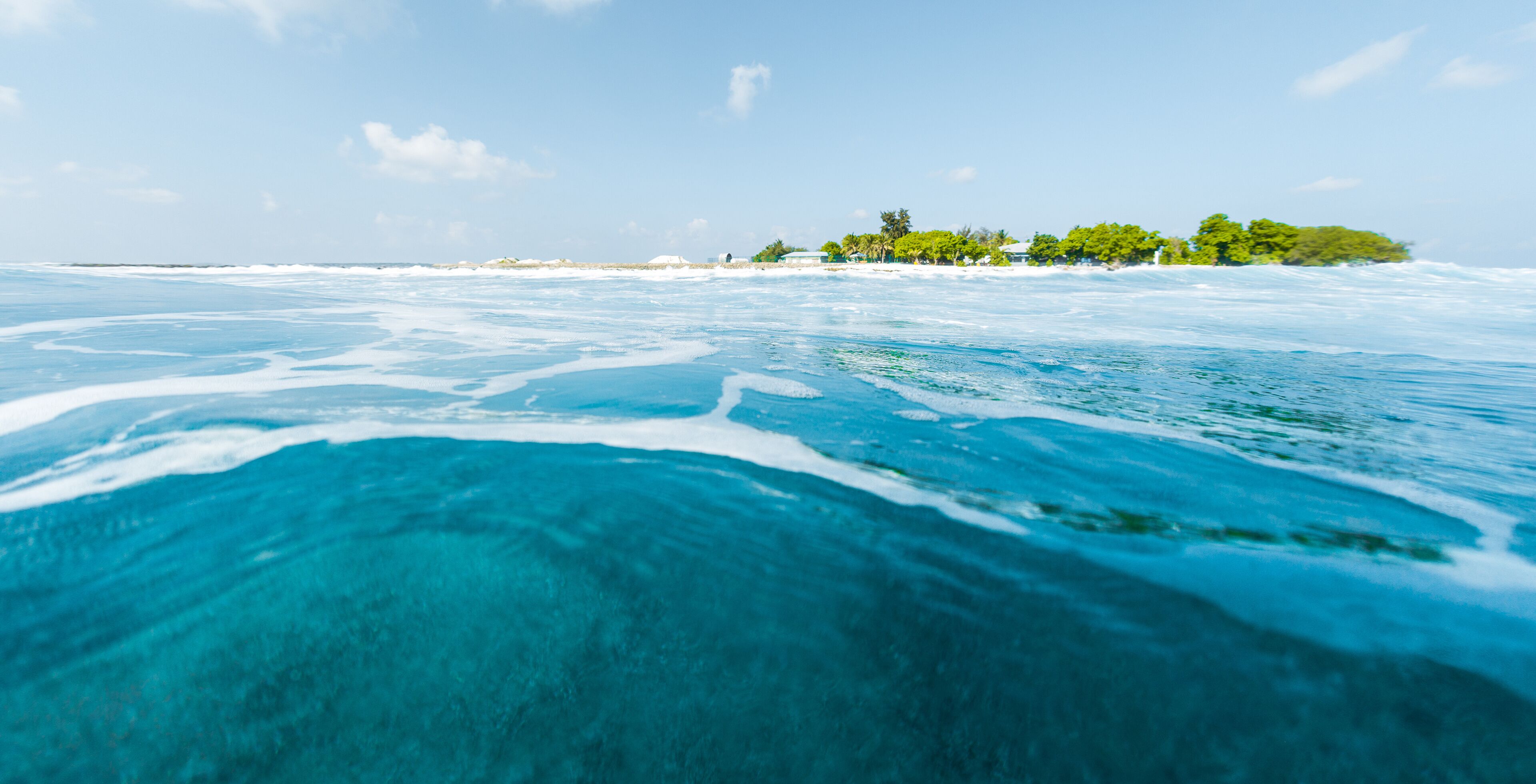 Tropical island and blue sea. View from low point