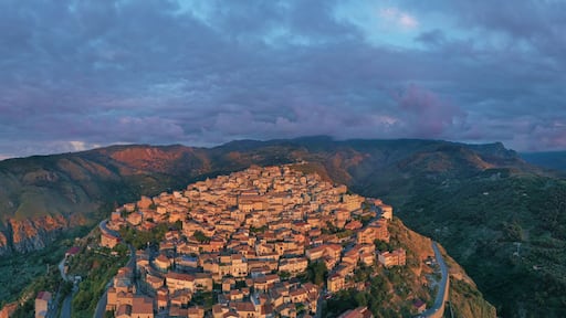 180 degree virtual reality panorama of a small village type perched on the mountains facing the sea during sunset over Nebrodi, Sicily, Italy.