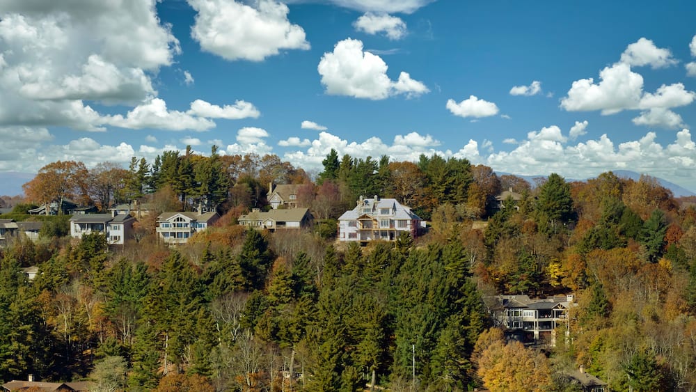 Aerial view of expensive american homes on hilltop in North Carolina mountains residential area. New family houses as example of real estate development in USA suburbs