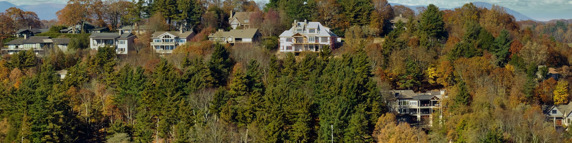 Aerial view of expensive american homes on hilltop in North Carolina mountains residential area. New family houses as example of real estate development in USA suburbs