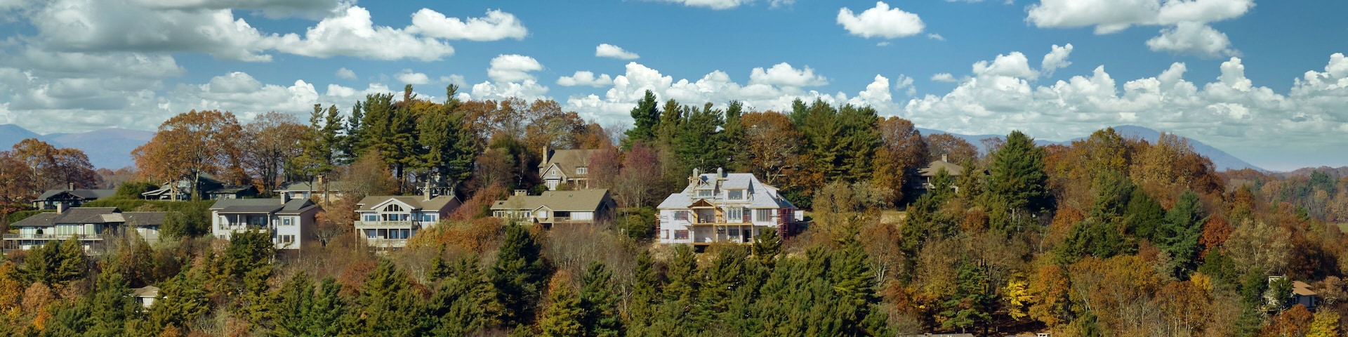 Aerial view of expensive american homes on hilltop in North Carolina mountains residential area. New family houses as example of real estate development in USA suburbs
