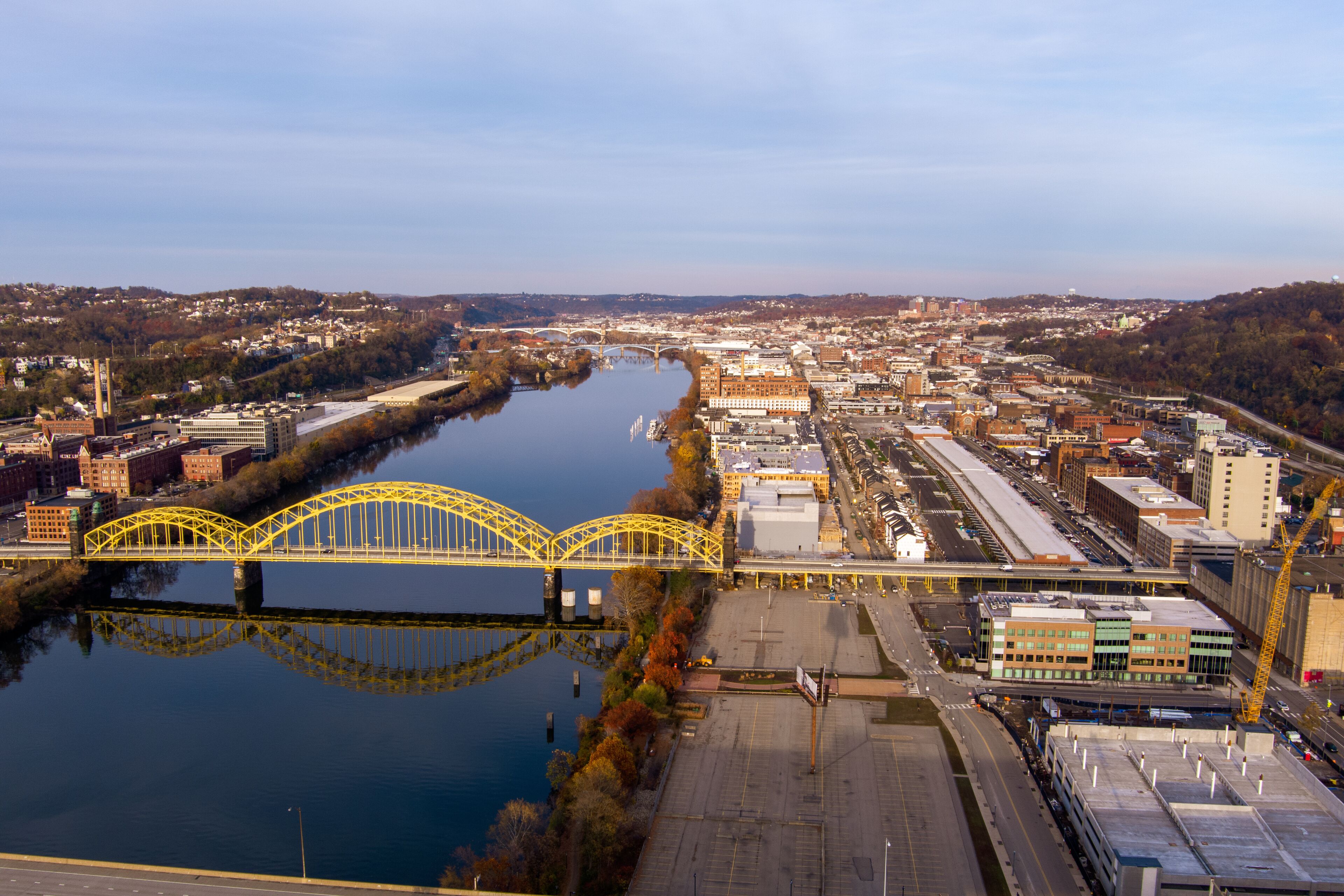 Aerial view of Pittsburgh, Pennsylvania's Strip District (right). The David McCullough 16th Street Bridge crosses the Allegheny River from Troy Hill (left).