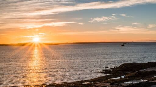 sunrise over the Bay of Fundy near Pocologan and New River Beach in New Brunswick with small tidal pools in the foreground