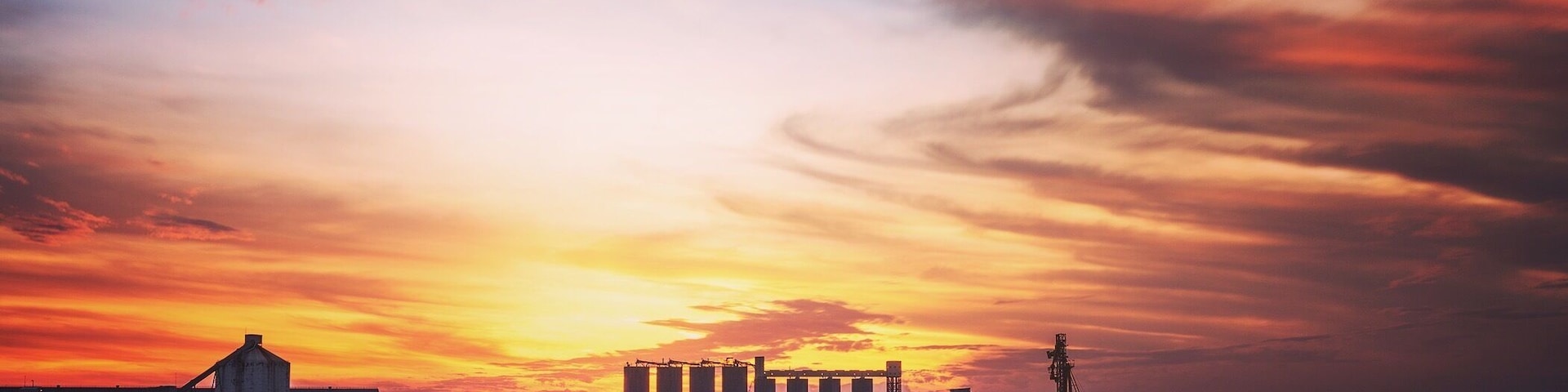 Out on the southern break wall over looking the sugar stacks as the sun sets.