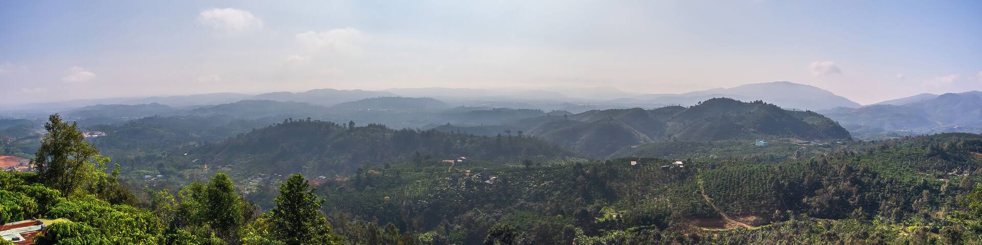 Beautiful view of local valley and mountain in misty near "Linh Quy Phap An" pagoda, Bao Loc town, Lam Dong Province, Vietnam.