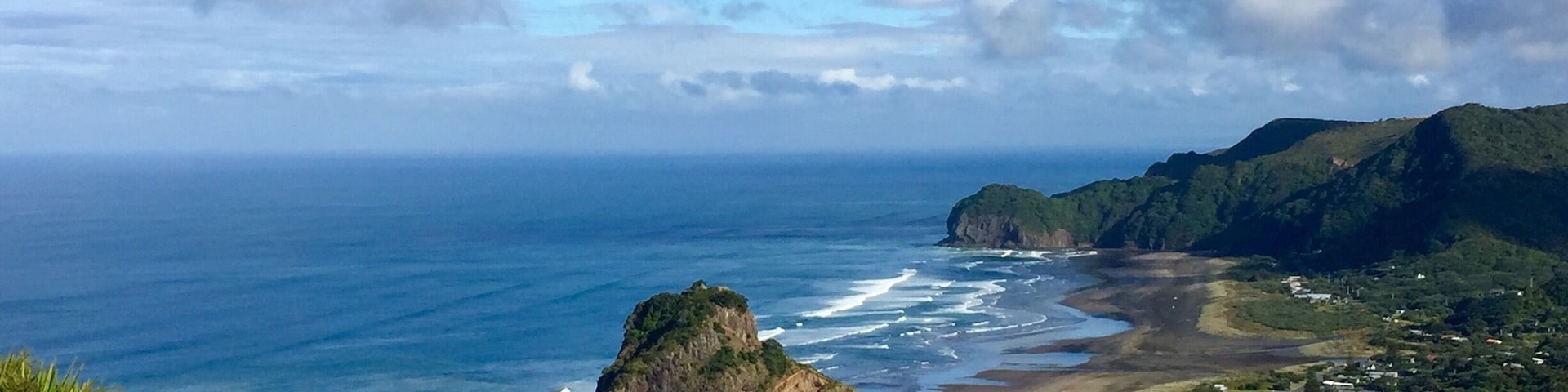 The first view of Piha Beach as you drive into the town. Here you see both sides of the beach and Lion Rock in the middle (well worth the climb). I thought the beach was better on the left side (from this pictures perspective) and made for better pictures, but at the intersection once in town going straight leads toward more of the right side of the beach and a cafe