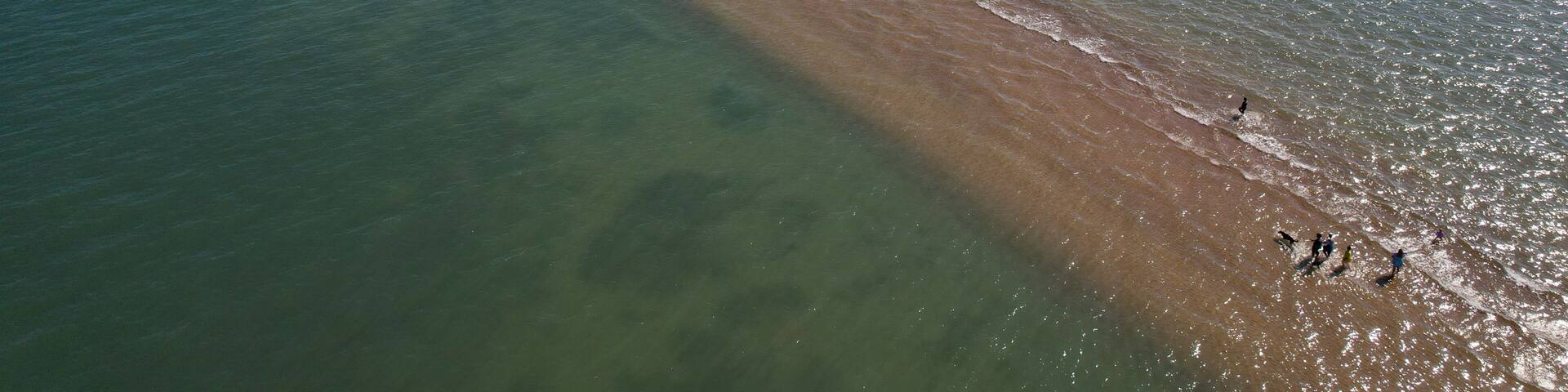 Wellington Point sandbar walk to King Island, Aerial View of a Narrow Sandbar Stretching into the Ocean