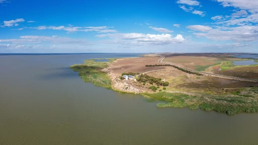 Aerial view of Point Malcom Lighthouse and Lake Alexandrina in a tranquil landscape, Meningie, South Australia, Australia.