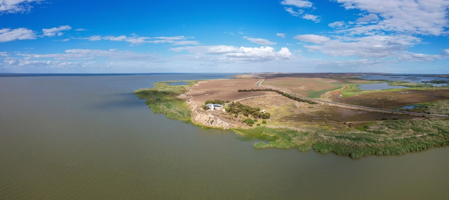 Aerial view of Point Malcom Lighthouse and Lake Alexandrina in a tranquil landscape, Meningie, South Australia, Australia.