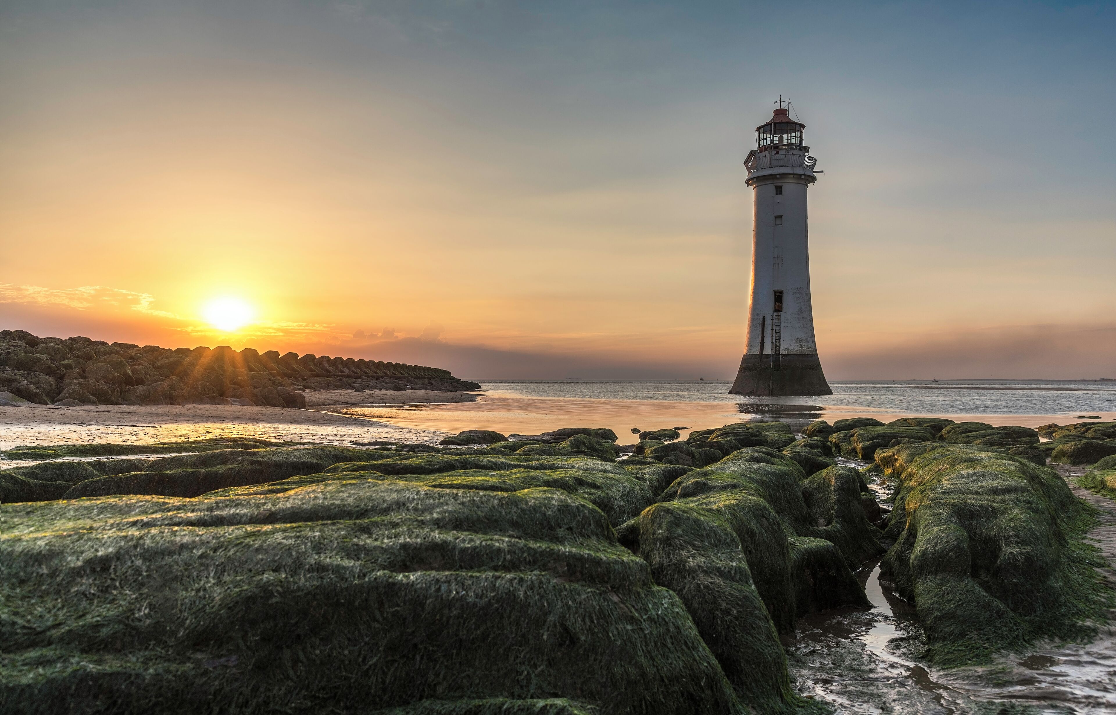 Summer sunset over Perch Rock Lighthouse, also known as New Brighton Lighthouse, New Brighton, Merseyside, England.
