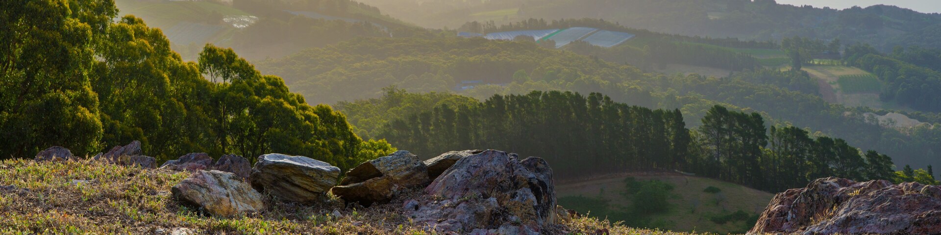 Valley view from rocky top of the hill late afternoon landscape