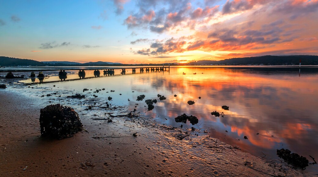 sunset over a body of water in woy woy on nsw central coast