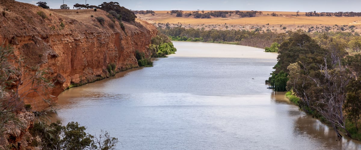 Landscape view of orange sandstone cliffs on the mighty Murray River near Young Husband in South Australia