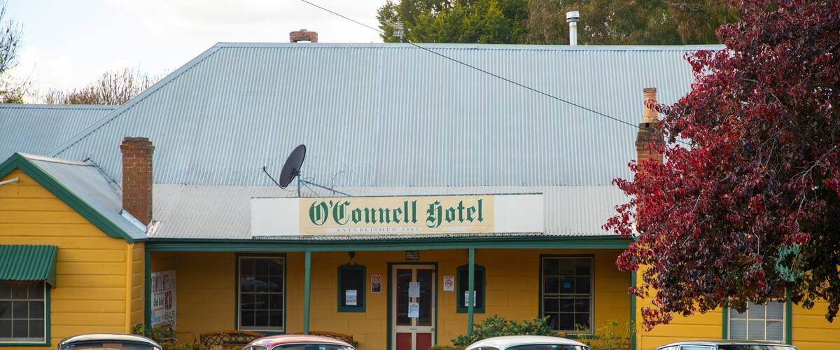 The O'Connell Hotel with a corrugated metal roof and a signboard.