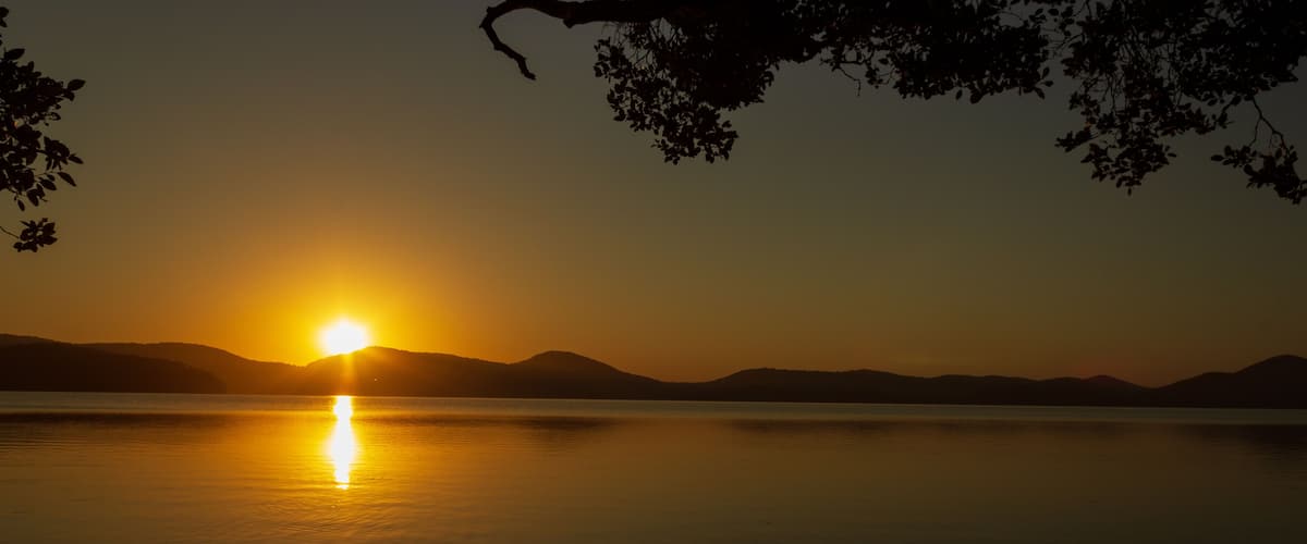 beautiful sunset over Watson Taylors Lake in Crowdy Bay National Park, New South Wales, Australia