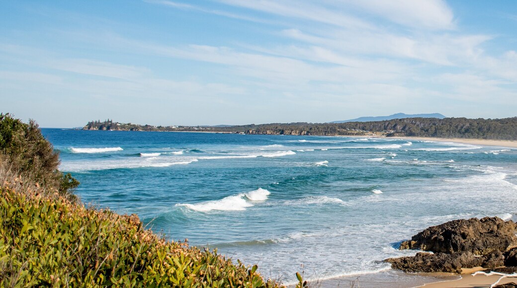Ocean waves with white foam on a sunny day. Nature tropical paradise background. Tuross Head, NSW, Australia